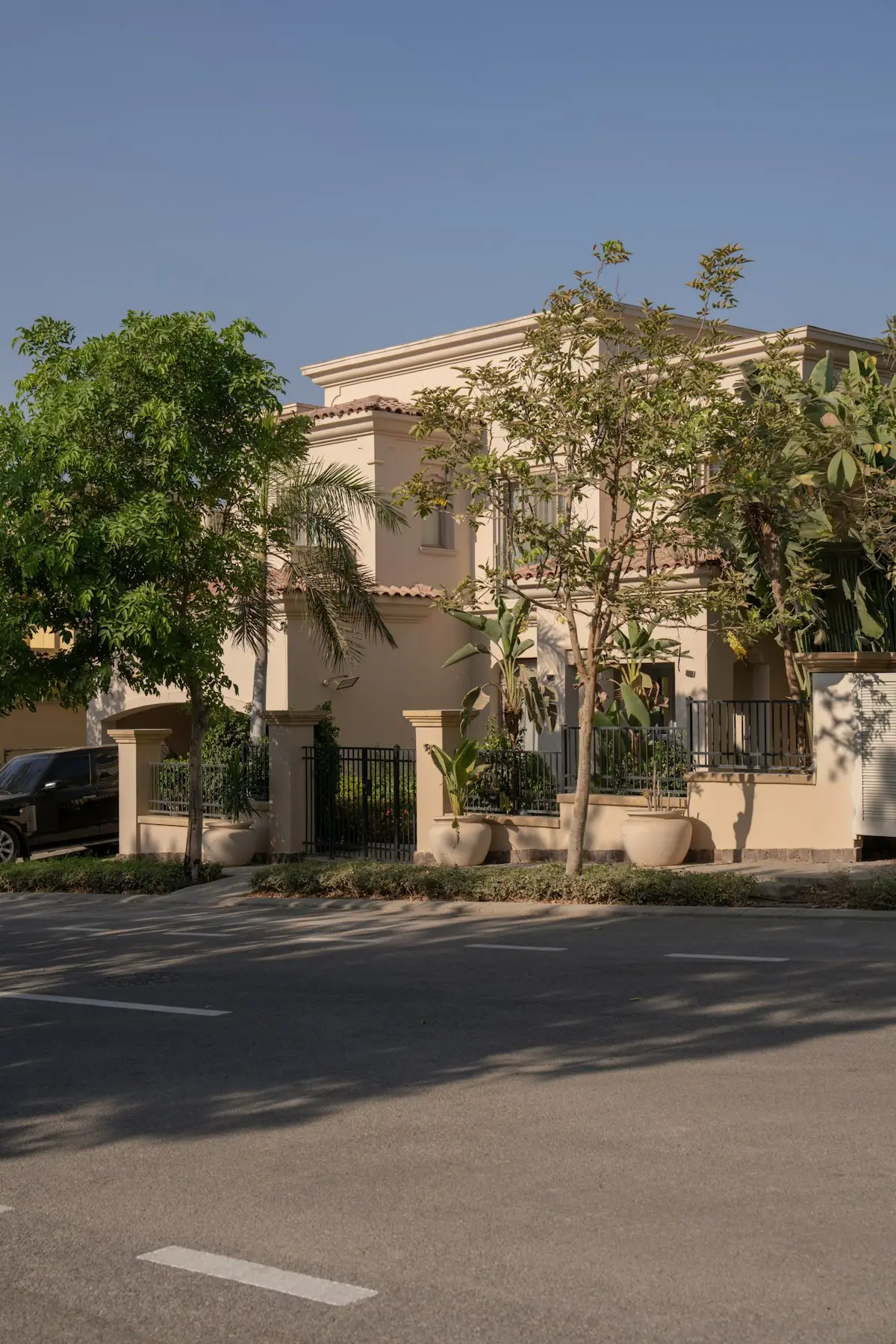 Modern residential home behind a perimeter fence